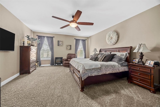 bedroom with baseboards, light carpet, and a ceiling fan