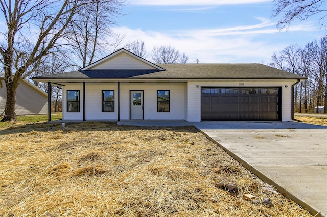 view of front of property with a porch, concrete driveway, a garage, and a shingled roof