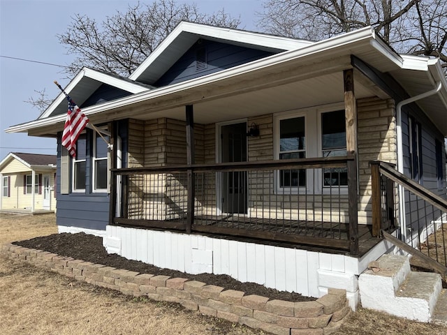 view of side of home featuring a porch