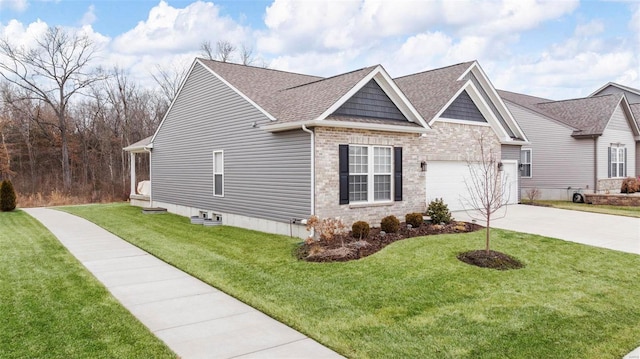 view of front of house featuring a garage and a front yard