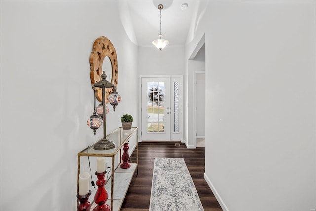 doorway with dark hardwood / wood-style floors