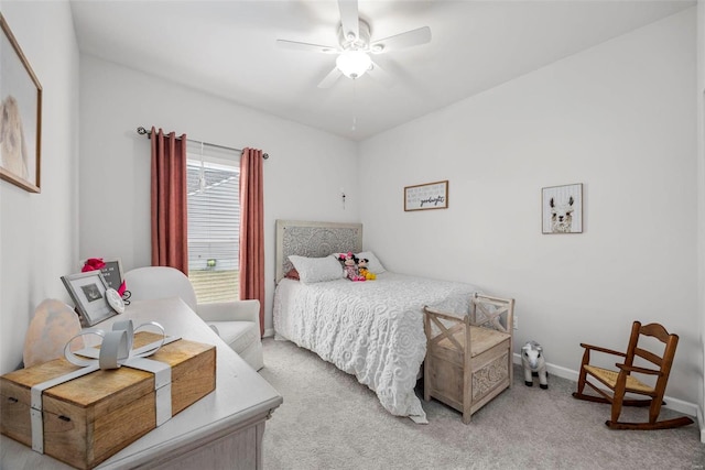 bedroom featuring light colored carpet and ceiling fan