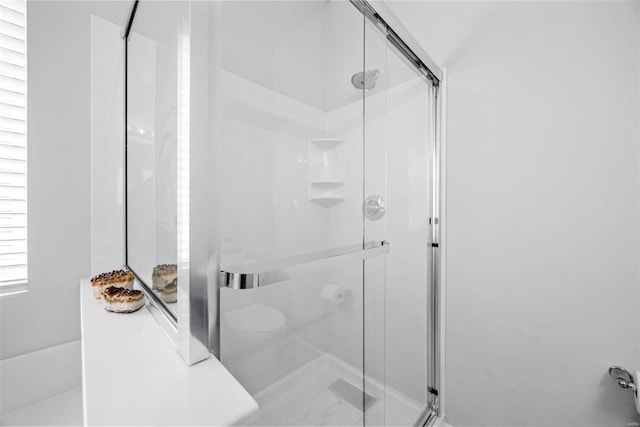 bathroom featuring an enclosed shower