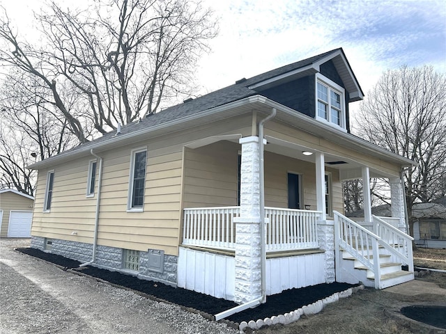 view of property exterior featuring a porch