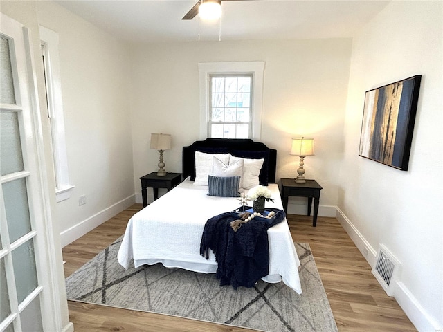 bedroom featuring ceiling fan and light hardwood / wood-style floors