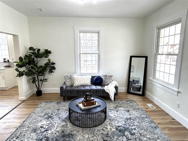 sitting room featuring light hardwood / wood-style floors