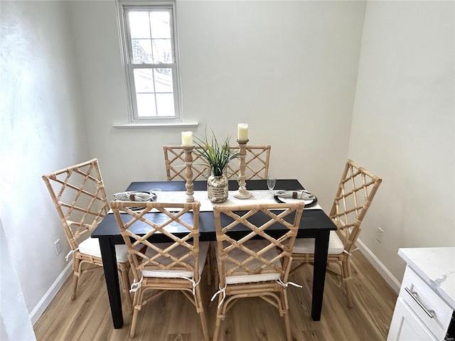 dining room with light wood-type flooring