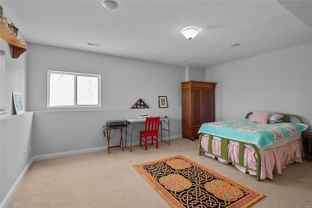 carpeted bedroom featuring visible vents and baseboards