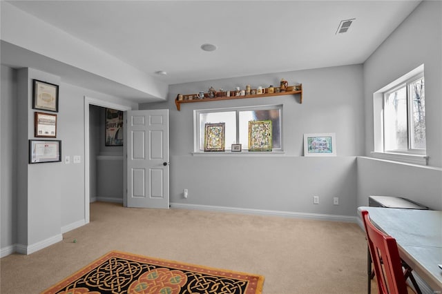 interior space with carpet, visible vents, and baseboards