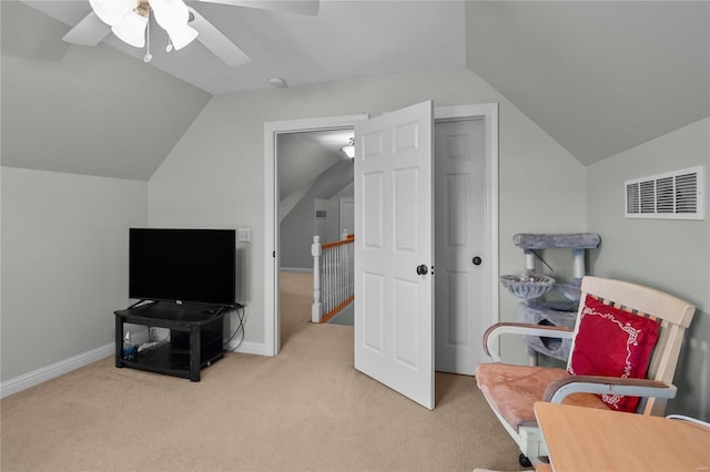 living area with vaulted ceiling, carpet flooring, visible vents, and baseboards