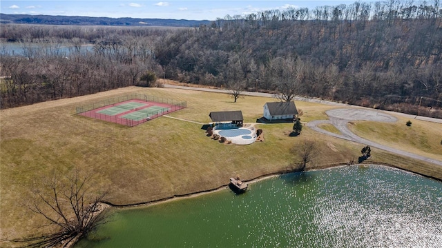 aerial view with a forest view and a water view