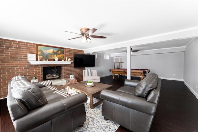 living room featuring a brick fireplace, billiards, baseboards, and wood finished floors