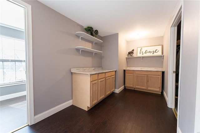 bar with dark wood finished floors and baseboards