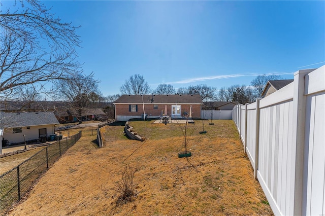 view of yard featuring a fenced backyard