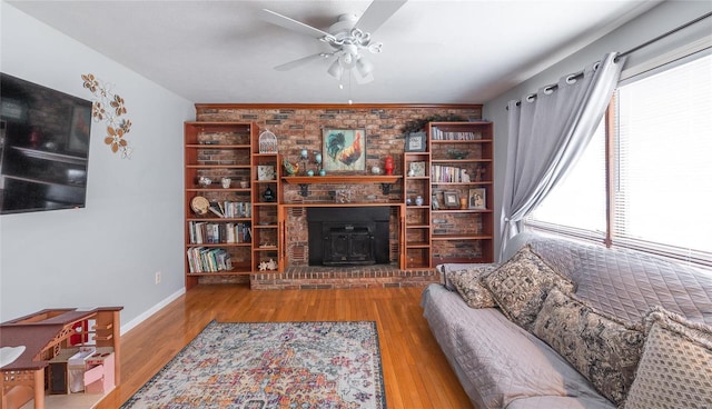 living room with ceiling fan and wood-type flooring