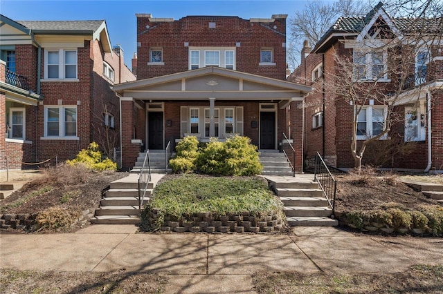 view of front of property featuring a porch and brick siding