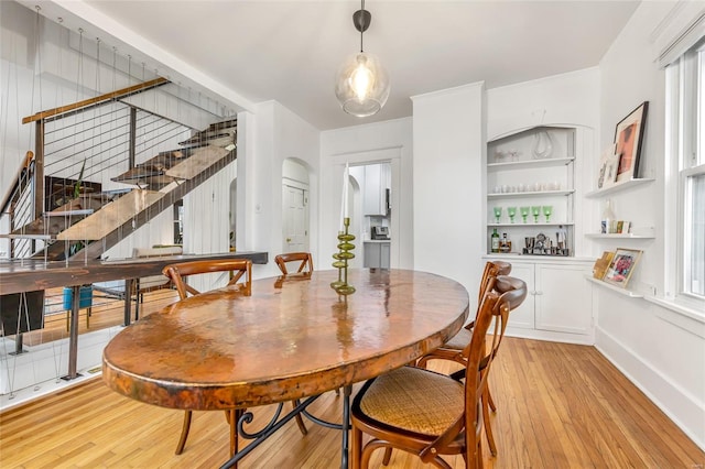 dining space with light hardwood / wood-style flooring