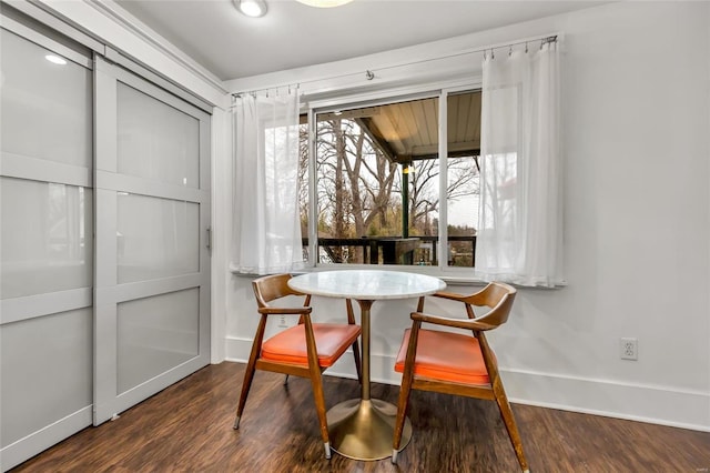 dining space featuring dark hardwood / wood-style flooring