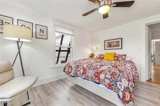 bedroom featuring ceiling fan and light wood-type flooring