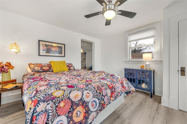 bedroom with ceiling fan and light hardwood / wood-style flooring