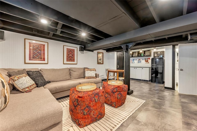 living room featuring concrete flooring