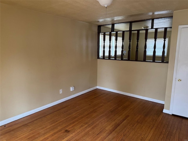 spare room featuring dark hardwood / wood-style floors