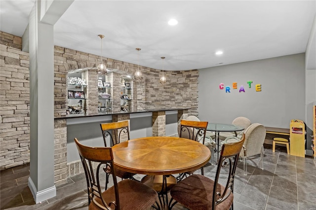 dining space featuring bar area