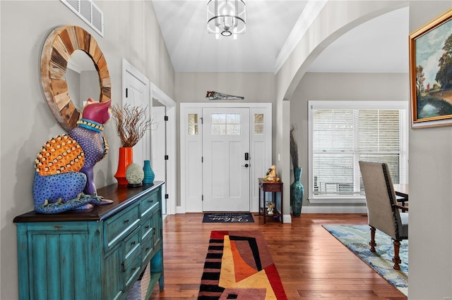 foyer featuring dark hardwood / wood-style floors and a notable chandelier