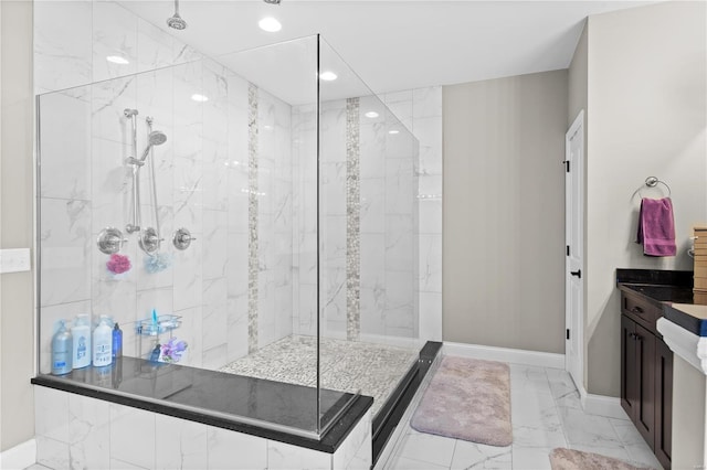 bathroom featuring vanity and a tile shower