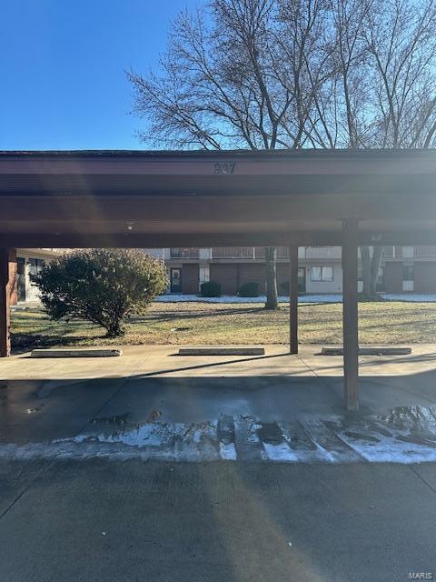 view of parking with a carport