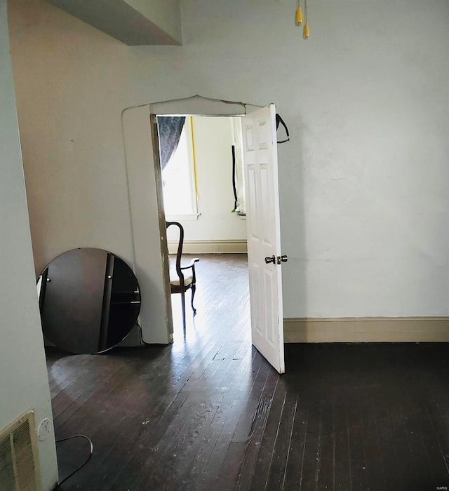 hall featuring dark wood-type flooring