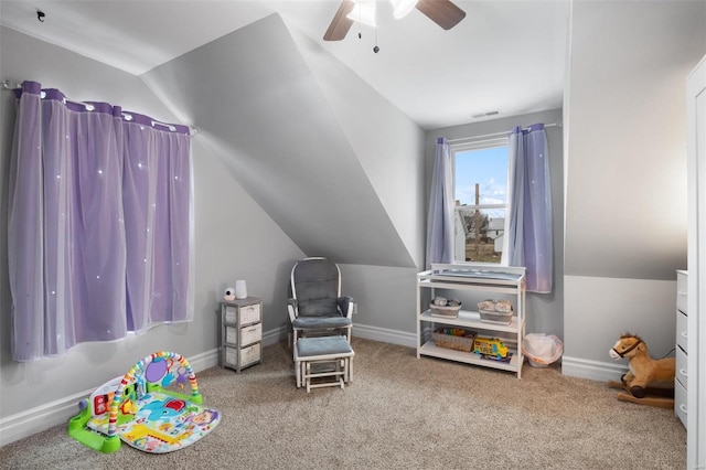 playroom featuring carpet floors, lofted ceiling, visible vents, a ceiling fan, and baseboards