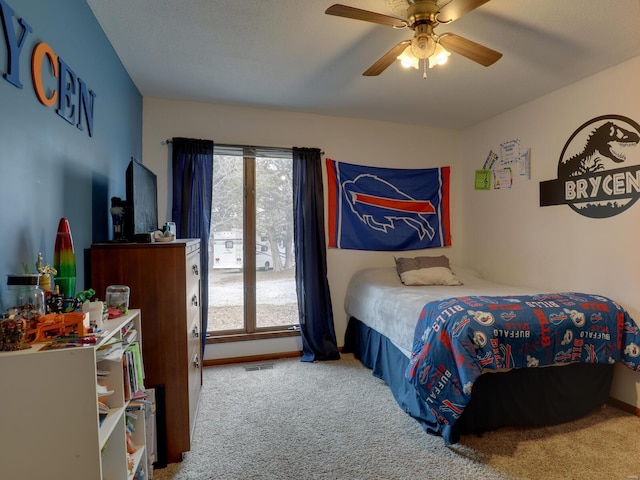 bedroom with ceiling fan and carpet