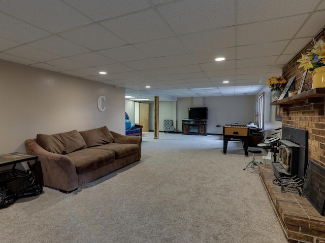 carpeted living room featuring a paneled ceiling