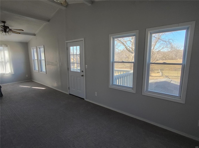 interior space featuring carpet floors, vaulted ceiling with beams, baseboards, and ceiling fan