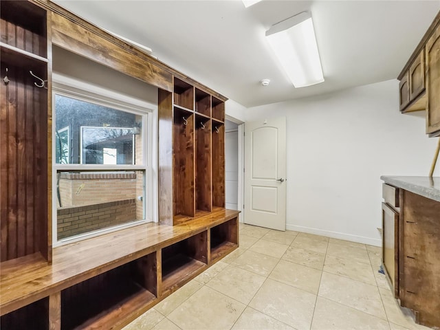 mudroom with light tile patterned floors