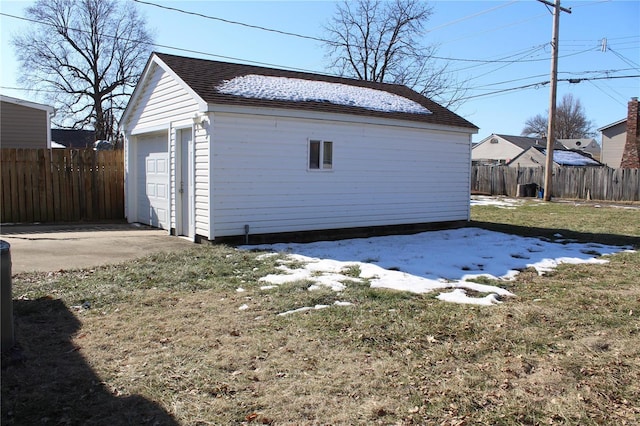 garage featuring a lawn