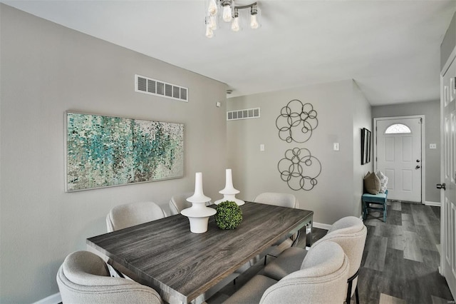 dining area featuring dark hardwood / wood-style floors