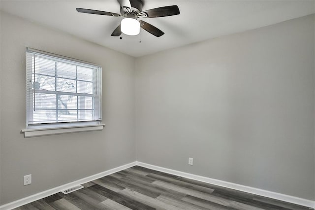 unfurnished room featuring ceiling fan and dark hardwood / wood-style floors