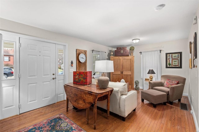 living room with light hardwood / wood-style flooring