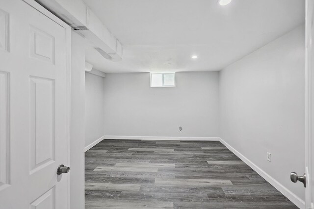 basement with dark wood-type flooring