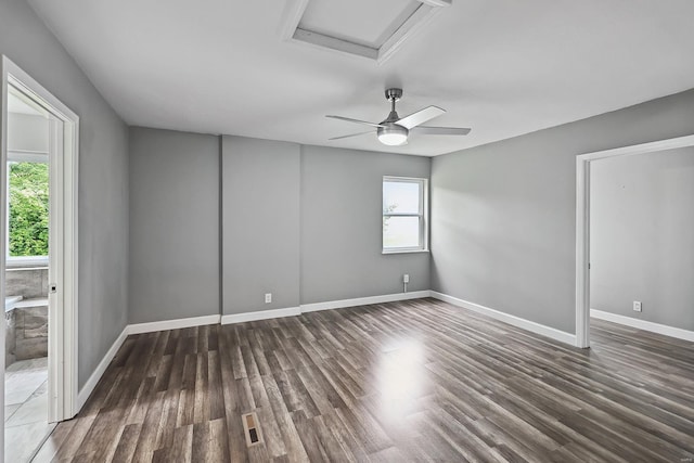 unfurnished room with dark hardwood / wood-style floors and ceiling fan