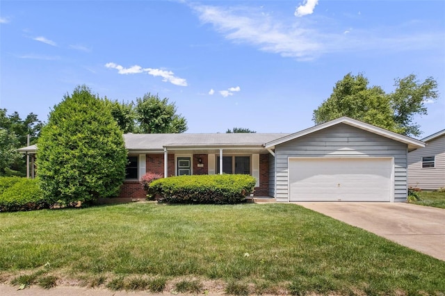 ranch-style home featuring driveway, a garage, a front lawn, and brick siding