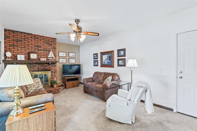 living room with baseboards, carpet, a ceiling fan, and a brick fireplace