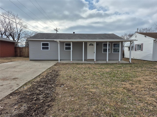 view of front of house with a porch and a front lawn