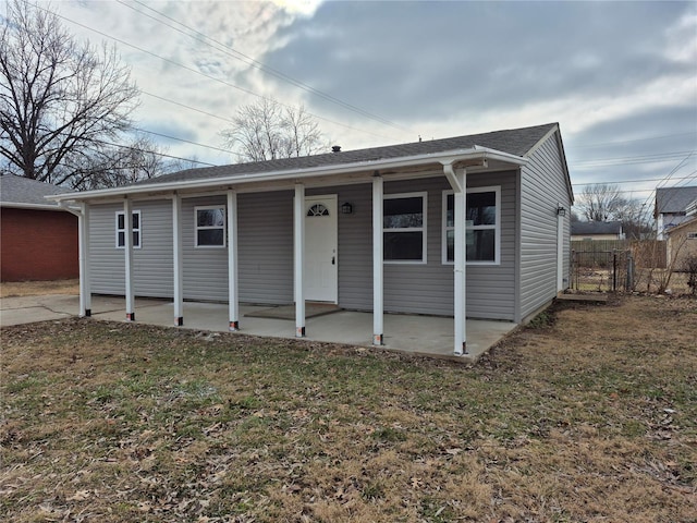 view of front of house with a front lawn and a patio area