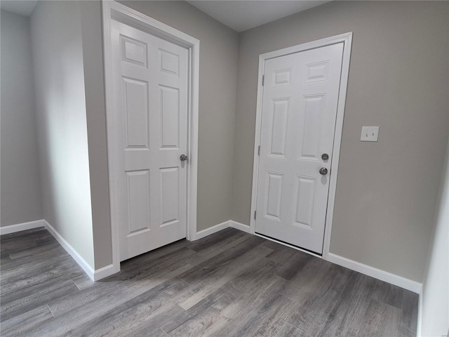 entryway with wood-type flooring