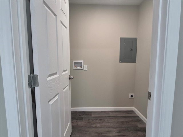 washroom featuring dark hardwood / wood-style flooring, electric panel, hookup for a washing machine, and electric dryer hookup