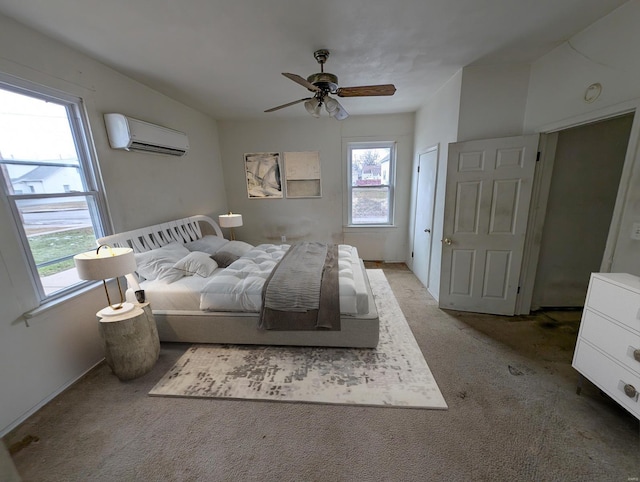 bedroom with light carpet, ceiling fan, and a wall mounted AC