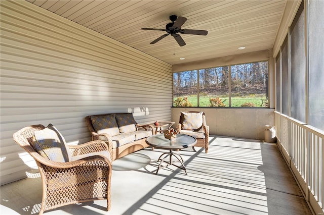 sunroom / solarium with wood ceiling and ceiling fan